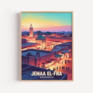 May include: A framed art print of Jemaa el-Fna in Marrakech. The artwork depicts a vibrant cityscape with a minaret, buildings, and people. The sky transitions from orange to blue. The text "JEMAA EL-FNA MARRAKECH" is at the bottom.