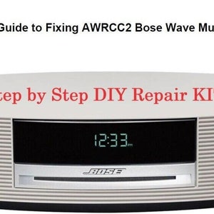 May include: A white Bose Wave Music System with a black display showing the time 12:33. The text "Step by Step DIY Repair KIT" is above the display. The text "Beginners Guide to Fixing AWRCC2 Bose Wave Music System" is above the system.