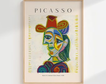 May include: A colorful abstract portrait of a woman wearing a red hat, titled "Bust of a Woman (Dora Maar)" by Pablo Picasso. The painting is in a minimalist frame with the artist's name "PICASSO" printed in black at the top.