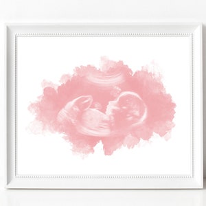 May include: A pink watercolor background with a black and white ultrasound image of a baby in the center.
