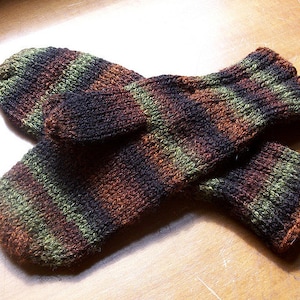 May include: A pair of striped knit mittens in shades of brown, green, and black.