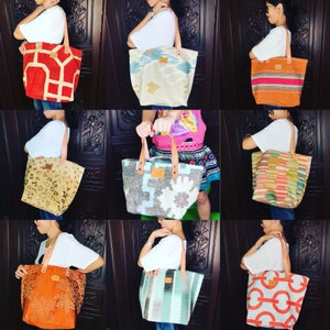 May include: Nine different tote bags with various colourful patterns and designs. The bags are made of woven fabric and have leather handles.