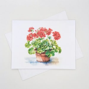 May include: A watercolor painting of a potted red geranium plant with green leaves. The plant is in a terracotta pot and is sitting on a wooden surface.