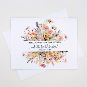 May include: A white greeting card with a floral design and the text "KIND WORDS ARE LIKE HONEY - sweet to the soul Proverbs 16:24". The card features a watercolor-style illustration of colorful flowers.