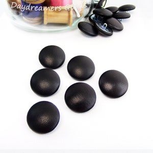 Leather buttons for clothing and upholstery.