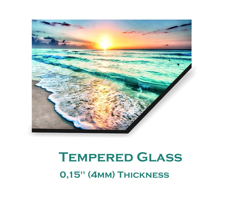 May include: A colourful sunset over a turquoise ocean with white foamy waves crashing on a sandy beach. The image is printed on tempered glass with a 0.15" (4mm) thickness.