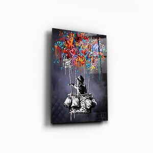 May include: A black and white illustration of a child holding onto a hot air balloon. The balloon is filled with colourful graffiti and drips of paint. The background is a dark grey.