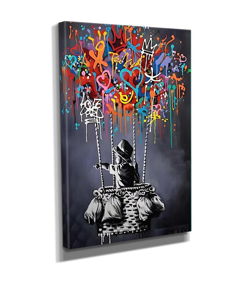 May include: A black and white illustration of a child in a hot air balloon. The balloon is filled with colourful hearts, stars, and other graffiti-style designs. The child is holding onto the basket and looking out at the viewer.