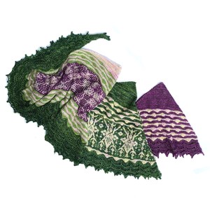 May include: A green, purple, and cream knitted shawl with a lacy border. The shawl is folded in thirds, with the different colored sections visible.