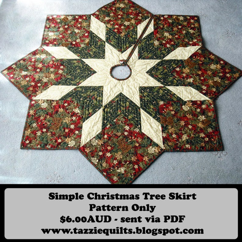 May include: A quilted Christmas tree skirt with a star design in shades of red, green, and white. The skirt is made of fabric with a floral pattern. The text "Simple Christmas Tree Skirt Pattern Only $6.00AUD - sent via PDF www.tazziequilts.blogspot.com" is printed at the bottom of the image.