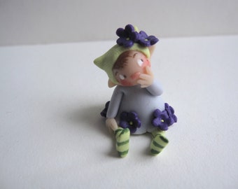 Tiny purple flower fairy figurine