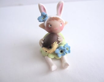 Little bunny figurine with  faux easter chocolate