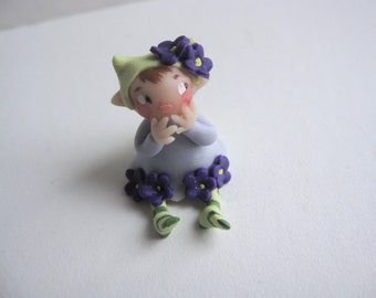 Tiny purple flower fairy figurine