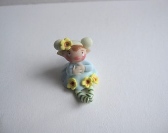 Tiny spring flower fairy figurine