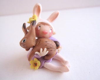 Miniature figurine of easter rabbit doll ornament with rabbit