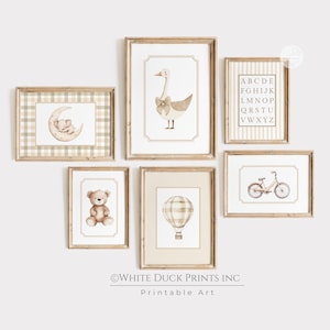 May include: A set of framed nursery art prints with watercolour illustrations. The prints depict a goose with a bow, a teddy bear, a hot air balloon, a bicycle, an alphabet chart, and an elephant on a moon, in soft neutral tones.