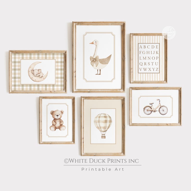 May include: A set of framed nursery art prints with watercolour illustrations. The prints depict a goose with a bow, a teddy bear, a hot air balloon, a bicycle, an alphabet chart, and an elephant on a moon, in soft neutral tones.