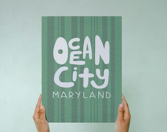 May include: A green and white canvas print with the text "Ocean City Maryland" in a whimsical font.