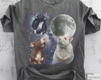 May include: Dark gray t-shirt featuring a graphic of three rats gazing upwards at a full moon against a starry background. The rats are in shades of black, brown, and white. The shirt has a vintage, worn look.