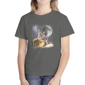 May include: Dark gray t-shirt featuring a graphic of three snakes with open mouths, a full moon, and a starry background. The snakes are in shades of brown and yellow. The shirt is a crew neck style.