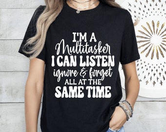 May include: Black t-shirt with white text that reads "I'm a Multitasker I can listen ignore & forget all at the same time."