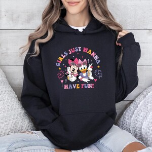 May include: Black hoodie with a graphic of Minnie Mouse and Daisy Duck holding ice cream cones. The graphic includes the text "Girls Just Wanna Have Fun!"