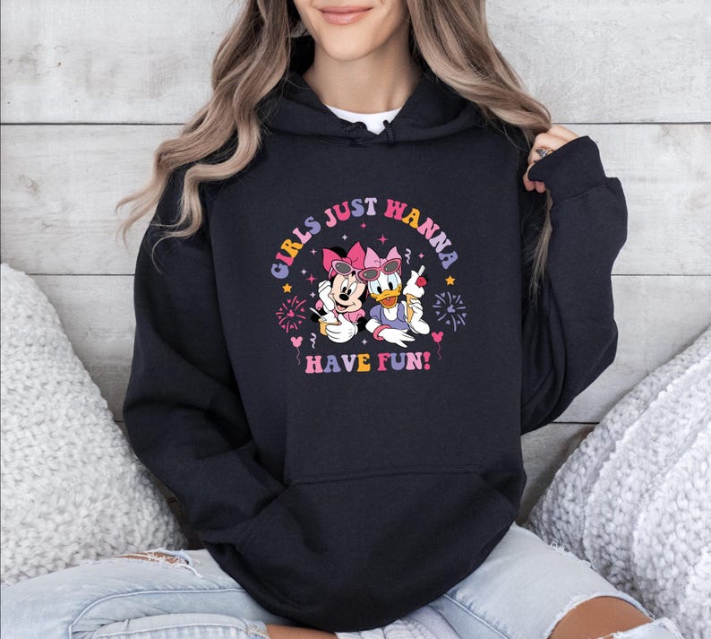 May include: Black hoodie with a graphic of Minnie Mouse and Daisy Duck holding ice cream cones. The graphic includes the text "Girls Just Wanna Have Fun!"