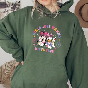 May include: Green hooded sweatshirt with a graphic print of Minnie Mouse and Daisy Duck. The graphic features the text "Girls Just Wanna Have Fun!" in a colorful retro font.