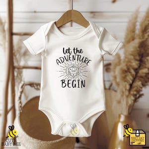 a baby bodysuit that says let the adventure begin