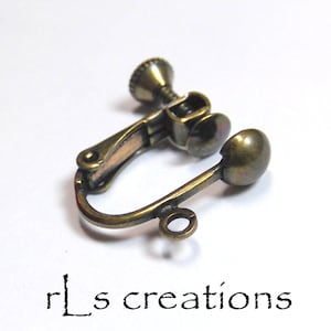 May include: A bronze-colored earring clip with a screw-on back and a small loop on the bottom.