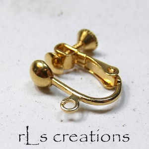May include: Gold tone clip-on earring with a round ball at the end and a screw-on closure.