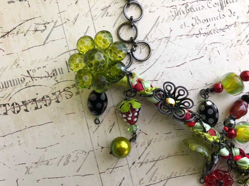 Red and green summer bee asymmetrical necklace with vintage buttons and bits!