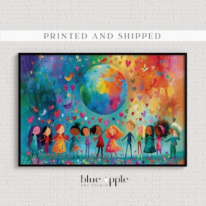 May include: A rectangular wall art print featuring a colorful illustration of a diverse group of children holding hands in a line beneath a large, vibrant globe. The background is filled with floating hearts, birds, and flowers in shades of blue, orange, and red. The text "PRINTED AND SHIPPED" appears above the image, and "blue apple ART STUDIO" is printed below.
