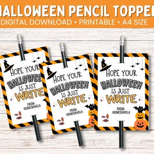 May include: Three Halloween pencil toppers with black and orange diagonal stripes. Each topper has a witch hat, spiders, and the text "Hope Your Halloween is Just Write" with a pumpkin and candy graphic.