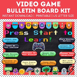 May include: A video game bulletin board kit with pixel art graphics. The text reads "Press Start to Learn!" alongside various buttons with phrases like "Start the Journey," "Level Up Your Learning," and "Conquer New Challenges" on a black background.
