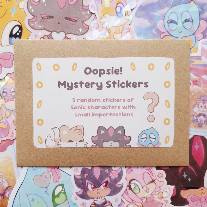 May include: A brown paper envelope with a white label that reads "Oopsie! Mystery Stickers." The label also states that it contains 5 random stickers of Sonic characters with small imperfections. The background is filled with colorful stickers.