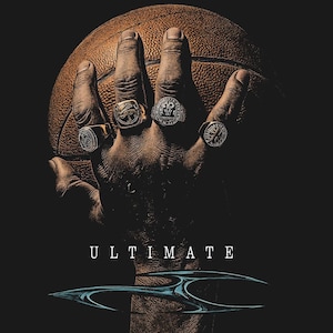 May include: A hand holding a basketball, adorned with multiple rings. The rings are silver and gold, with intricate designs. The word "ULTIMATE" is displayed in white text below the hand, with a blue and silver graphic.