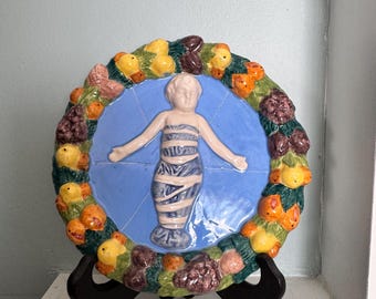 Vintage Italian ceramic wall plaque in the style of Della Robbia