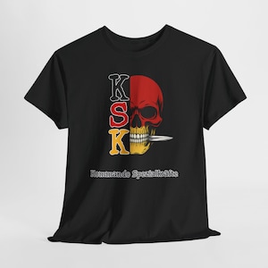 May include: Black t-shirt featuring a red and yellow skull design with a knife in its teeth. The letters "KSK" are vertically stacked on the left side of the skull. The text "Kommando Spezialkräfte" is below the skull.