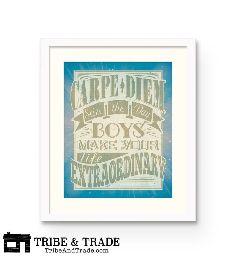 May include: Framed art print with the words "Carpe Diem, Seize the Day, Boys, Make Your Life Extraordinary" in a vintage style. The artwork features a blue and beige color scheme, with a white frame. The Tribe & Trade logo is at the bottom.