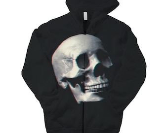 May include: A black zip-up hoodie featuring a large, centered graphic of a human skull. The skull design has a distinct glitch effect with red and blue color shifts along the edges, set against the solid black fabric of the garment.