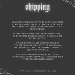 May include: A dark gray informational graphic with white text titled shipping. The design features white spider web illustrations in the corners and hanging spiders on the left side. The text provides details regarding delivery times and contact information.