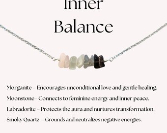 May include: A silver chain necklace with a row of seven different colored stones, including pink, white, gray, and black. The necklace is labeled "Inner Balance" and includes the following text: "Morganite - Encourages unconditional love and gentle healing. Moonstone - Connects to feminine energy and inner peace. Labradorite - Protects the aura and nurtures transformation. Smoky Quartz - Grounds and neutralizes negative energies."