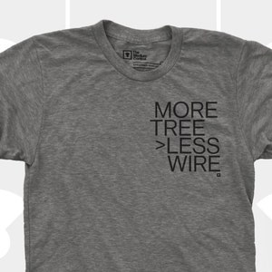 May include: A heather grey t-shirt with the text "MORE TREE > LESS WIRE" printed on the front.
