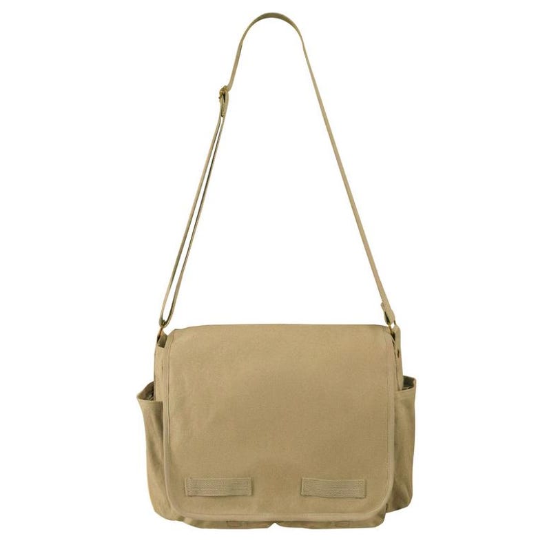 May include: A tan messenger bag with a long, adjustable shoulder strap. The bag has a flap closure with two buckle straps and two side pockets. The bag is made of a durable canvas material.