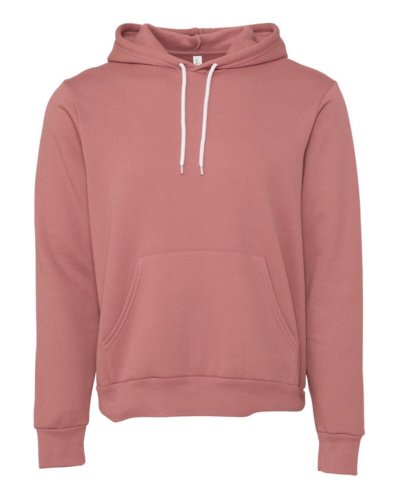 May include: A solid-colored, dusty rose hoodie with a kangaroo pocket and a drawstring hood. The hoodie has long sleeves and a ribbed hem and cuffs. The white drawstrings are visible against the pink fabric. The hoodie is made of a soft, comfortable material.