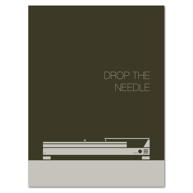 May include: A minimalist print featuring a turntable design in shades of gray and white against a dark olive-green background. The text "DROP THE NEEDLE" is displayed in a clean, sans-serif font above the turntable illustration. The print has a modern aesthetic.