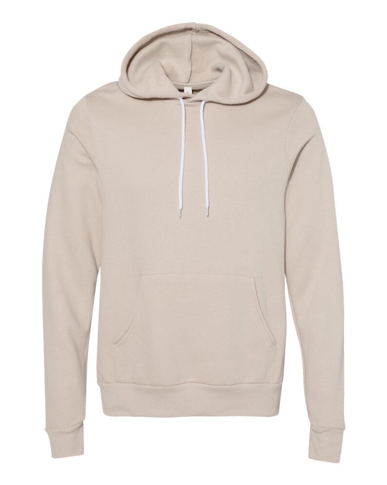 May include: A beige hoodie with a drawstring hood and a kangaroo pocket. The long-sleeved sweatshirt has a relaxed fit and is made of a soft material. The hoodie is a neutral color, suitable for casual wear.