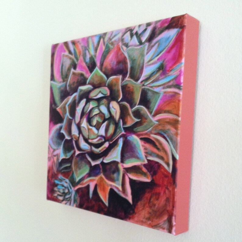 May include: A close-up of a painting of a succulent plant with green, purple, and pink leaves. The background is a dark red color.