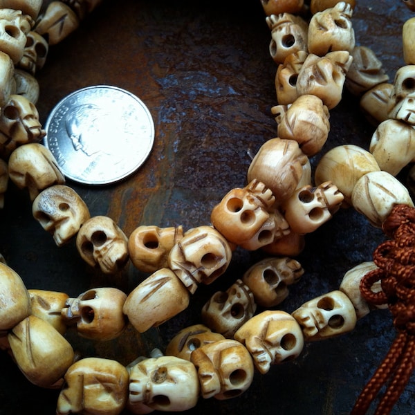 108 carved yak bone mala 8-9 x 10-11mm skull beads